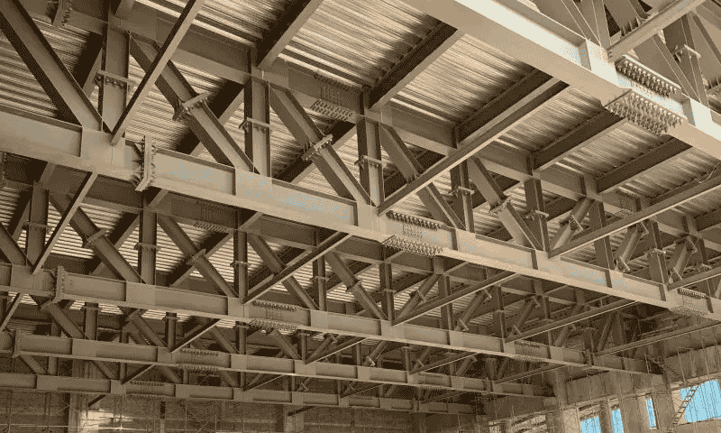 Struktur baja balok pondasi mentransmisikan gravitasi, memastikan distribusi gaya